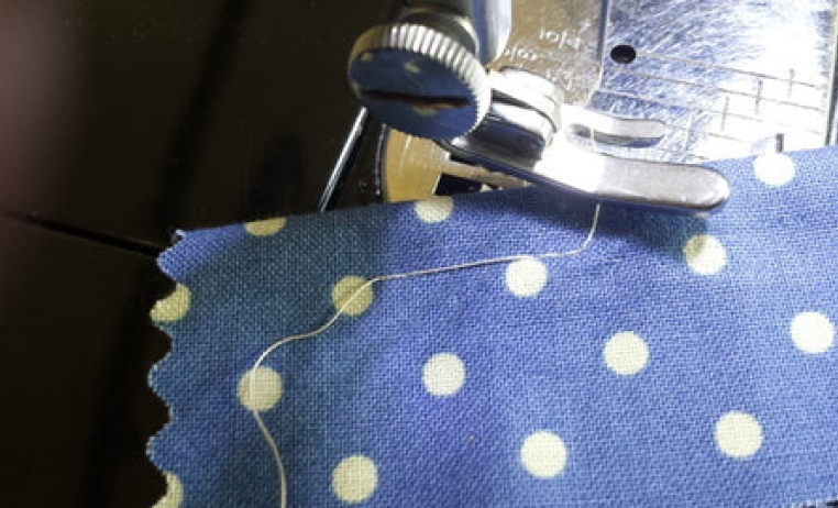 Why is my Featherweight skipping stitches or not picking up the bobbin thread?